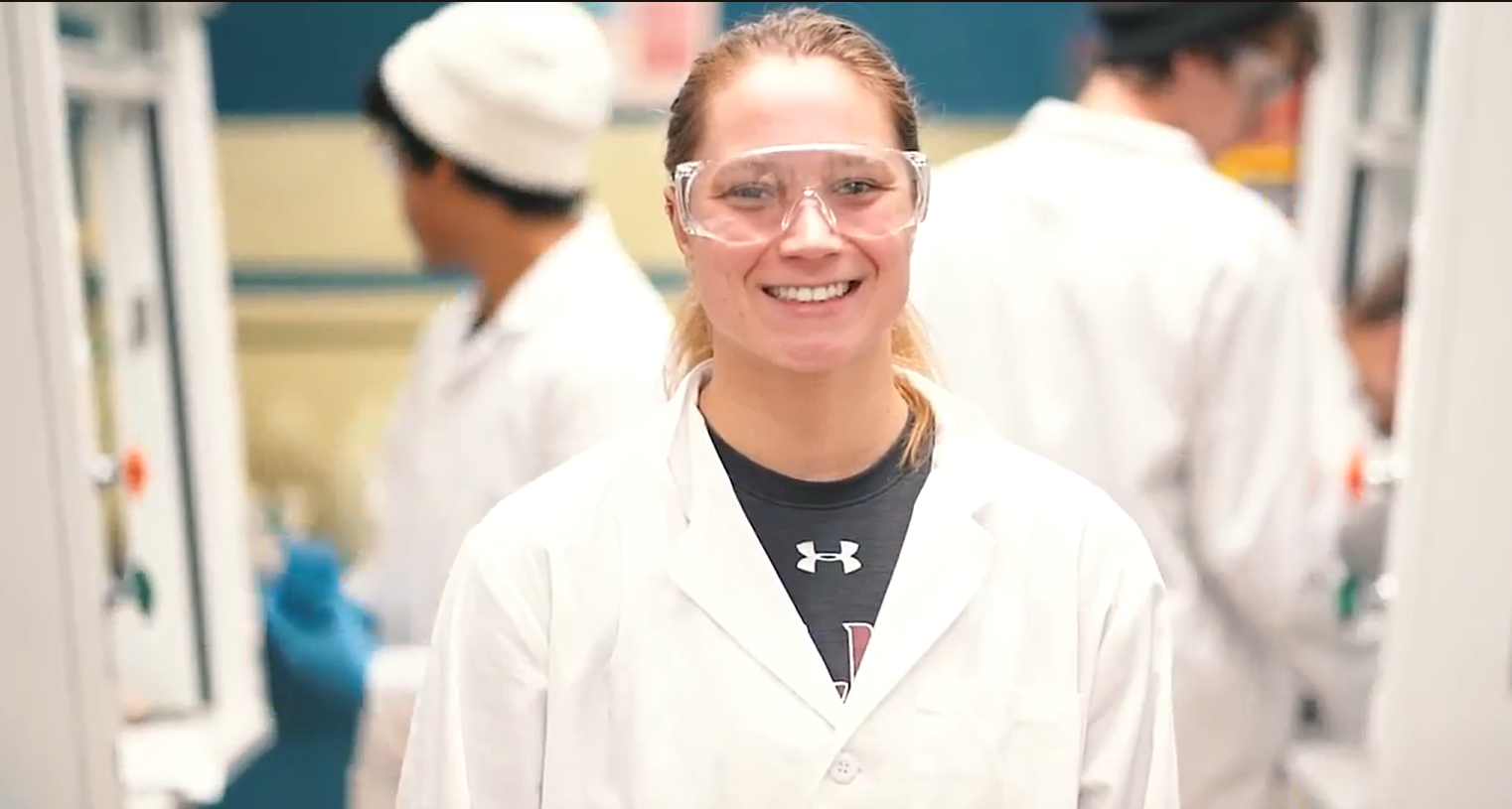 SIU Student in lab coat