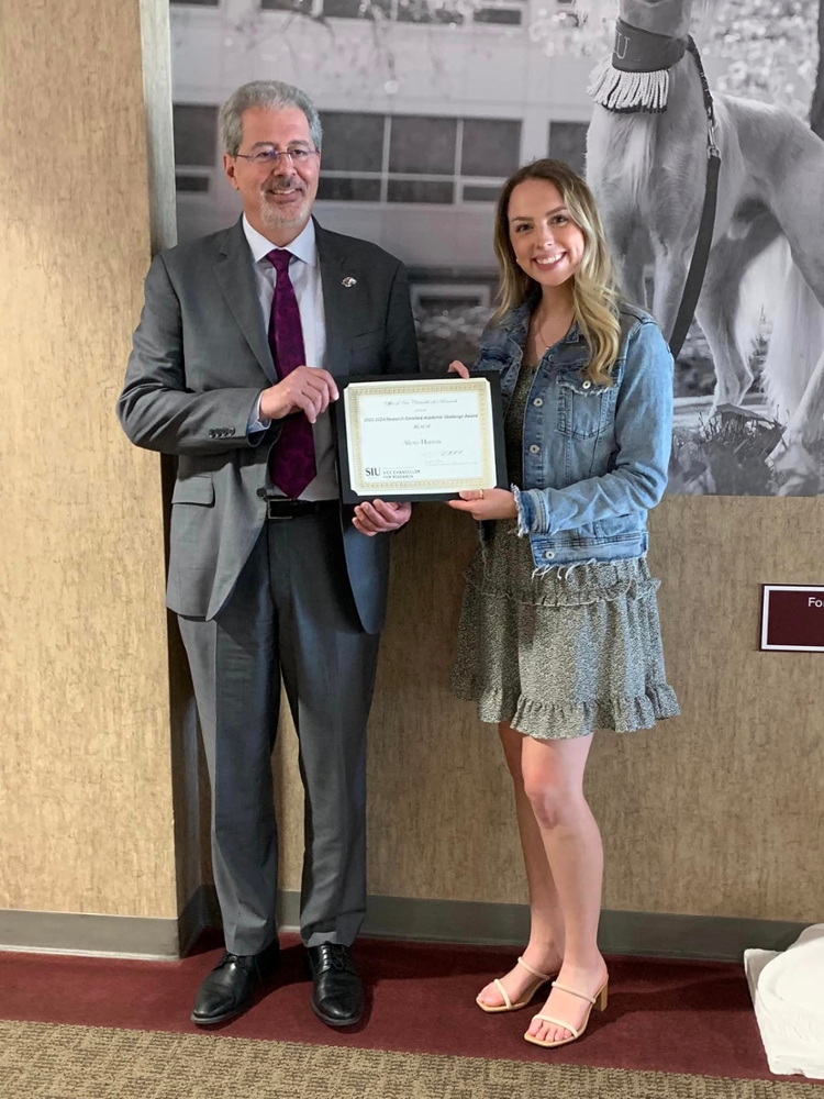 Dr. Tsatsoulis with 2023 SRCAF Top PosterAwardee